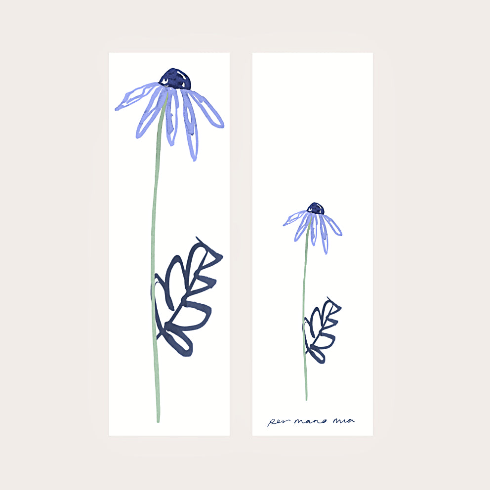 Back and front of a blue daisy bookmark, displayed side-by-side on a light pink background.