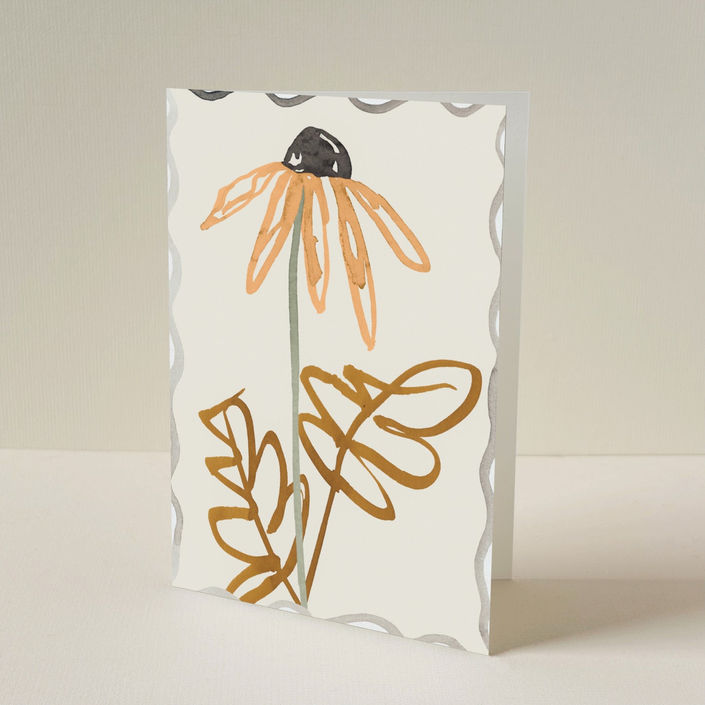 A greeting card with a scalloped border, featuring a minimalist illustration of a orange daisy on a warm cream background.