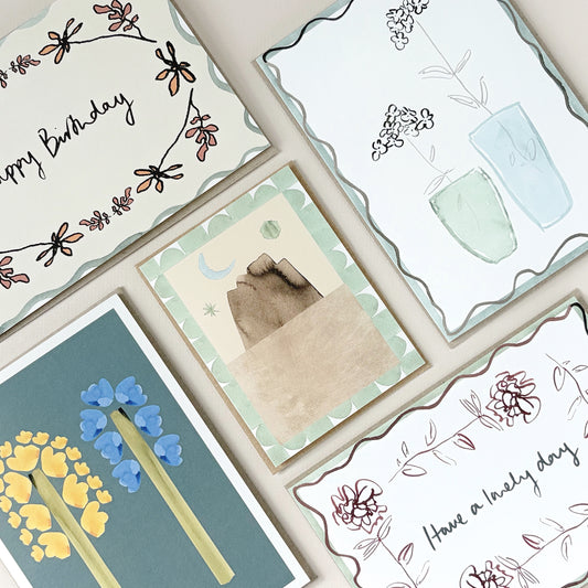 A collection of 5 hand-designed greeting cards with floral, birthday and art illustrations in soft neutral tones